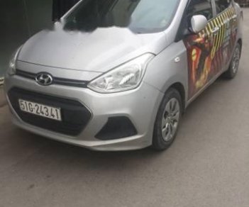 Hyundai Grand i10 2016 - Cần bán gấp Hyundai Grand i10 sản xuất năm 2016, màu bạc giá cạnh tranh