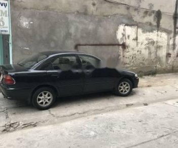 Mazda 323   1999 - Bán xe Mazda 323 đời 1999, màu đen xe gia đình