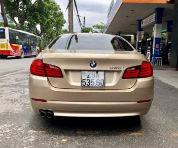 BMW 5 Series 520i 2012 - BMW 5 Series 520i sản xuất 2012, màu vàng, nhập khẩu