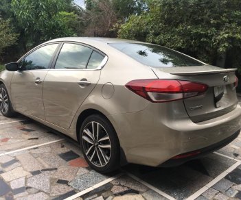 Kia Cerato AT 2016 - Cần bán Kia Cerato AT sản xuất 2016, màu nâu 