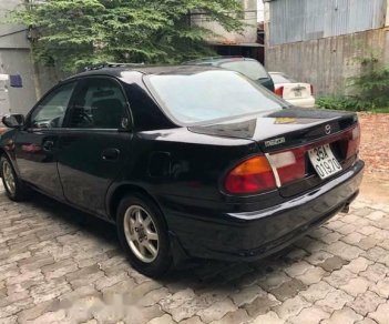 Mazda 323 1999 - Bán ô tô Mazda 323 đời 1999, màu đen còn mới, giá 88tr