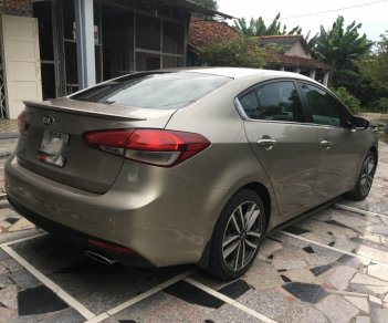 Kia Cerato AT 2016 - Cần bán Kia Cerato AT sản xuất 2016, màu nâu 