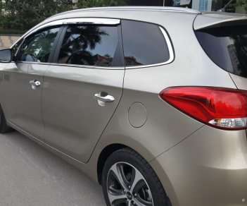 Kia Rondo GAT 2.0 AT 2015 - Bán Kia Rondo GAT 2.0 AT số tự động, model 2016, đời T12/2015, màu vàng cát mới 95%