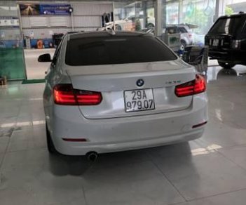 BMW 3 Series 320i 2013 - Cần bán lại xe BMW 320i sản xuất năm 2013, màu trắng, nhập khẩu nguyên chiếc, 888tr