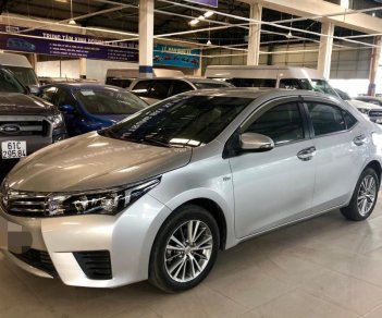 Toyota Corolla altis 1.8MT 2016 - Bán Toyota Corolla Altis 1.8MT sản xuất năm 2016, màu bạc, có trả góp