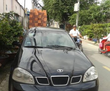 Daewoo Lacetti 2004 - Bán ô tô Daewoo Lacetti sản xuất 2004, màu đen số sàn