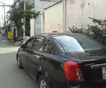 Daewoo Lacetti 2004 - Bán ô tô Daewoo Lacetti sản xuất 2004, màu đen số sàn