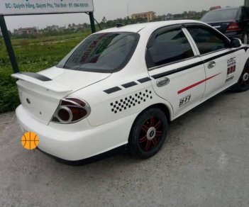 Kia Spectra   2004 - Cần bán Kia Spectra năm 2004, màu trắng, xe đẹp, chạy êm ổn định