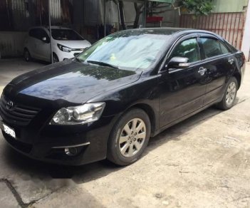 Toyota Camry 2.4G 2009 - Cần bán xe Toyota Camry 2.4G sản xuất năm 2009, màu đen còn mới, giá tốt