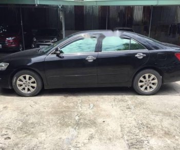 Toyota Camry 2.4G 2009 - Cần bán xe Toyota Camry 2.4G sản xuất năm 2009, màu đen còn mới, giá tốt