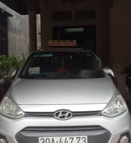 Hyundai Grand i10 2014 - Cần bán lại xe Hyundai Grand i10 năm 2014, màu bạc, bản đủ