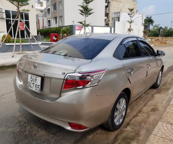 Toyota Vios E 2016 - Cần bán xe Toyota Vios (1.5 E) CVT, sản xuất 2016, màu ghi-vàng, gia đình sử dụng mới 98%