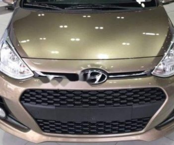 Hyundai Grand i10   2018 - Cần bán Hyundai Grand i10 2018, màu vàng giá tốt