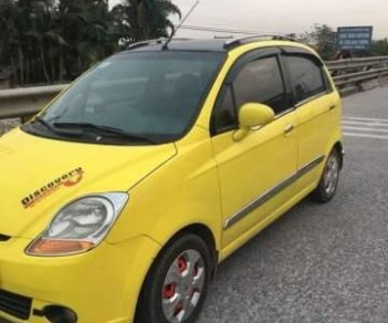 Chevrolet Spark MT 2009 - Bán xe Chevrolet Spark MT sản xuất 2009, màu vàng, giá 98tr