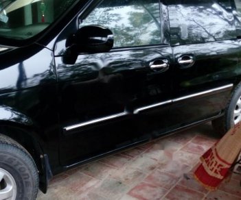 Kia Carnival GS 2.5 MT 2006 - Bán Kia Carnival GS 2.5 MT sản xuất 2006, màu đen, xe gia đình