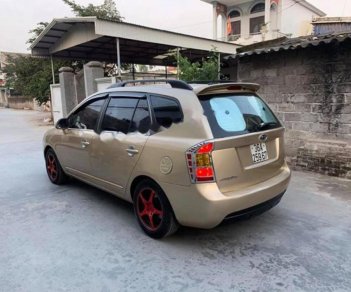 Kia Carens LX 1.6 MT 2011 - Bán Kia Carens LX 1.6 MT sản xuất năm 2011, màu vàng, giá 258tr