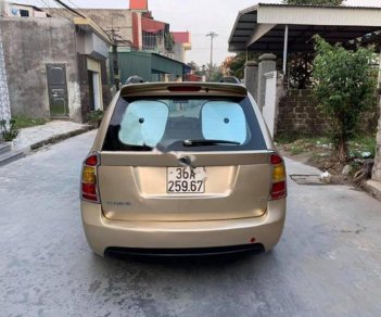 Kia Carens LX 1.6 MT 2011 - Bán Kia Carens LX 1.6 MT sản xuất năm 2011, màu vàng, giá 258tr