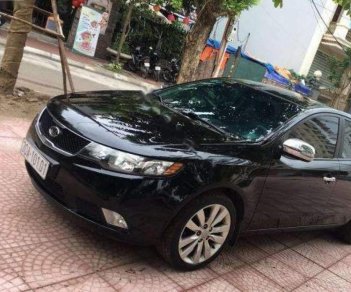 Kia Forte SLi 1.6 AT 2009 - Cần bán lại xe Kia Forte SLi 1.6 AT đời 2009, màu đen, nhập khẩu