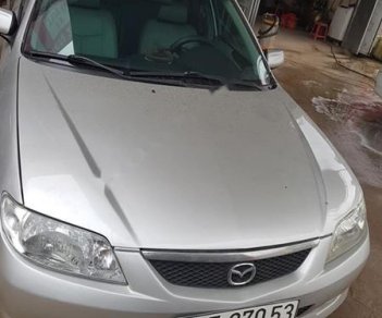 Mazda 323 2004 - Bán ô tô Mazda 323 2004, màu bạc như mới