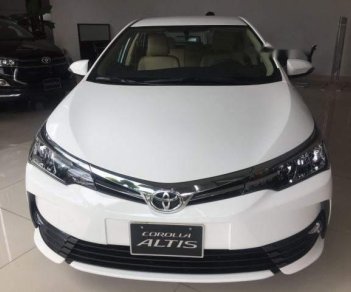 Toyota Corolla altis  1.8E   2018 - Bán ô tô Toyota Corolla altis 1.8E đời 2018, màu trắng, 718tr