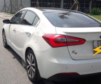Kia K3  2.0   2015 - Cần bán lại xe Kia K3 2.0 năm sản xuất 2015, màu trắng 