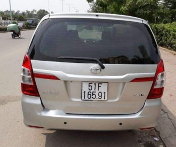 Toyota Innova 2015 - Cần bán xe Toyota Innova đời 2015, màu bạc xe gia đình