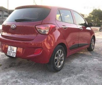 Hyundai Grand i10   2014 - Cần bán gấp Hyundai Grand i10 đời 2014, màu đỏ, số tự động