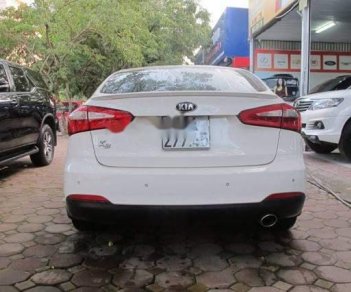 Kia K3   1.6L  2014 - Cần bán xe Kia K3 1.6L đời 2014, màu trắng chính chủ