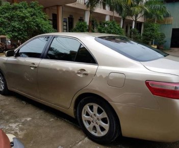 Toyota Camry 2.4LE 2007 - Bán Toyota Camry 2.4LE 2007, màu vàng, nhập khẩu