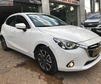 Mazda 2 1.5 AT 2016 - Cần bán gấp Mazda 2 1.5 AT sản xuất 2016, màu trắng chính chủ 