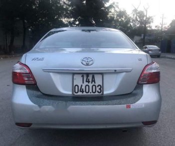 Toyota Vios E 2012 - Cần bán Toyota Vios E sản xuất 2012, màu bạc chính chủ, giá 330 triệu