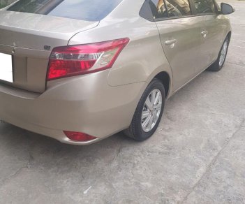 Toyota Vios 1.5E 2017 - Cần bán xe Toyota Vios 2017 bản E số tự động. Xe màu vàng cát