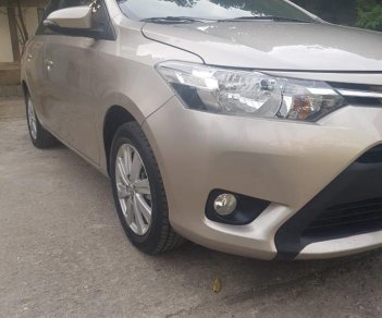 Toyota Vios 1.5E 2017 - Cần bán xe Toyota Vios 2017 bản E số tự động. Xe màu vàng cát