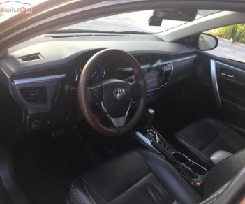 Toyota Corolla altis AT 1.8G 2014 - Bán Toyota Corolla altis AT 1.8G sản xuất 2014, màu nâu, giá 650tr