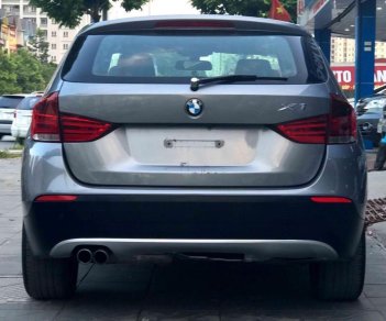 BMW X1 2010 - Bán xe BMW X1 sản xuất 2010 màu xám (ghi), giá 587 triệu, xe nhập