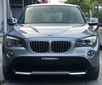 BMW X1 2010 - Bán xe BMW X1 sản xuất 2010 màu xám (ghi), giá 587 triệu, xe nhập