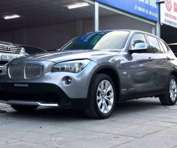 BMW X1 2010 - Bán xe BMW X1 sản xuất 2010 màu xám (ghi), giá 587 triệu, xe nhập