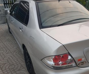 Mitsubishi Lancer 2004 - Cần bán Mitsubishi Lancer AT đời 2004, màu xám (ghi) còn mới, giá 228 triệu