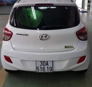 Hyundai Grand i10 1.2AT 2015 - Bán Hyundai Grand i10 1.2AT sản xuất 2015, màu trắng, nhập khẩu nguyên chiếc xe gia đình