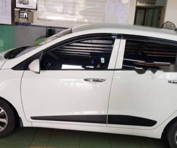 Hyundai Grand i10 1.2AT 2015 - Bán Hyundai Grand i10 1.2AT sản xuất 2015, màu trắng, nhập khẩu nguyên chiếc xe gia đình