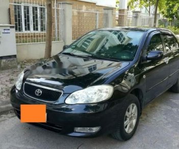 Toyota Corolla altis   2004 - Bán xe Toyota Corolla Altis, màu đen, đời 2004, số tay, nhiên liệu 7 lít, mới đi 12,0000 km