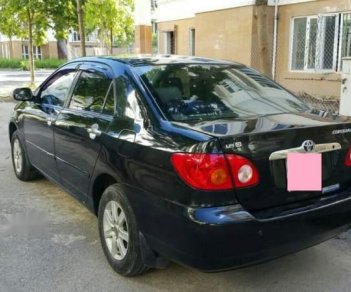 Toyota Corolla altis   2004 - Bán xe Toyota Corolla Altis, màu đen, đời 2004, số tay, nhiên liệu 7 lít, mới đi 12,0000 km