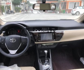 Toyota Corolla altis 1.8G AT 2015 - Bán Toyota Corolla altis 1.8G AT đời 2015, màu nâu  