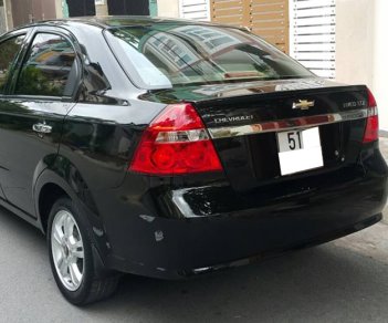 Chevrolet Aveo LTZ 2015 - Cần tiền bán gấp Chevrolet Aveo 2015 số tự động màu đen