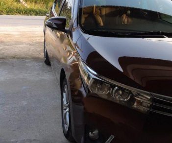 Toyota Corolla altis 1.8G MT 2015 - Bán Toyota Corolla altis 1.8G MT đời 2015, màu nâu, đẹp như mới