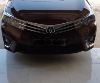 Toyota Corolla altis 1.8G MT 2015 - Bán Toyota Corolla altis 1.8G MT đời 2015, màu nâu, đẹp như mới
