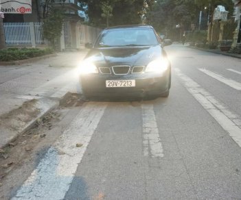 Daewoo Lacetti EX 1.6 MT 2004 - Gia đình bán ô tô Daewoo Lacetti EX 1.6 MT đời 2004, màu đen, 135tr