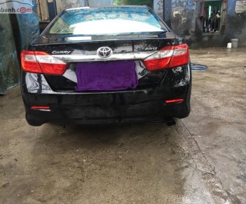 Toyota Camry 2.0E 2013 - Cần bán lại xe Toyota Camry 2.0E năm 2013, màu đen còn mới