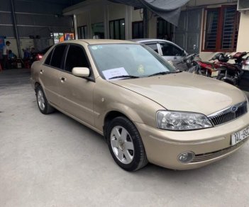 Ford Laser 1.8 MT 2003 - Cần bán gấp Ford Laser 1.8 MT sản xuất 2003, màu vàng