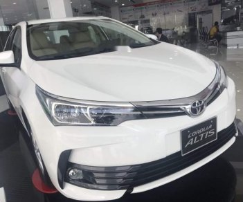 Toyota Corolla altis 2019 - Bán Toyota Corolla Altis năm sản xuất 2019, màu trắng, 700 triệu